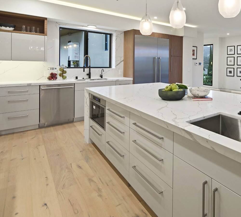 Kitchen with marble island and wood floors