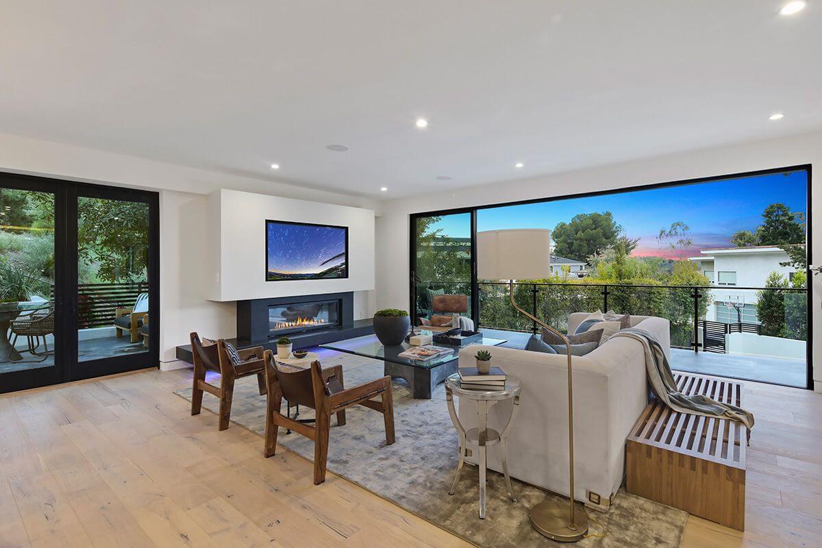 Open living room with rug on wood floor